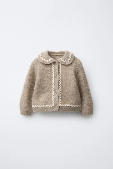 Вязаный кардиган с воланом