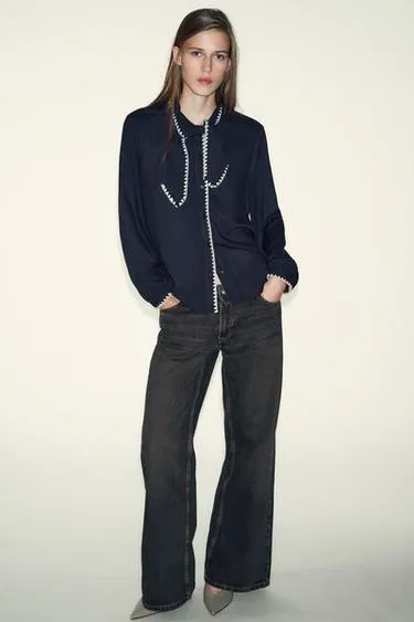 Блуза с бантом и контрастной отстрочкой- Заказать в России