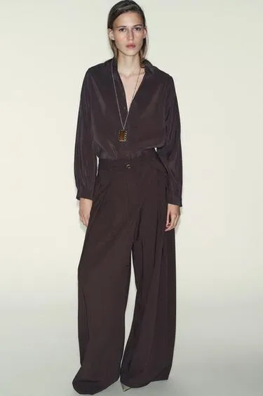 Брюки с широкими штанинами и тонким ремнем- Заказать в России