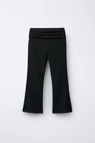 Зауженные брюки с заклепками- Заказать в России