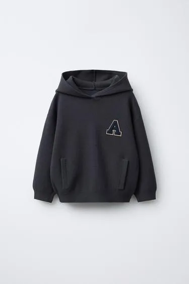 Трикотажный джерси с нашивкой-буквой- Заказать в России