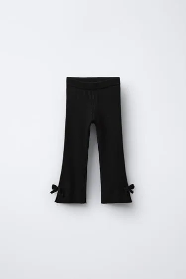 Расклешенные трикотажные легинсы с бантиками