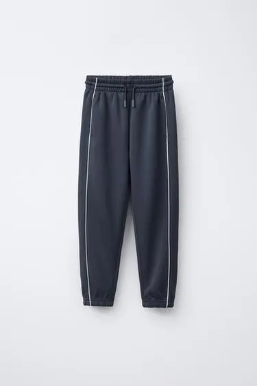 Брюки-джоггеры с контрастной отделкой- Заказать в России