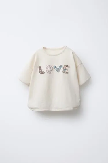 Футболка с текстовыми нашивками- Заказать в России