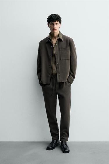 Zara Комфортные несминаемые брюки с манжетами на талии купить с доставкой.