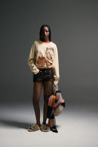 Zara Мини-шорты из кожзама с эффектом комбинированной кожи HARRY LAMBERT для ZARA X DISNEY купить с доставкой.