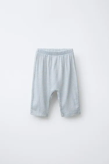 Брюки из рельефной ткани в клетку- Заказать в России