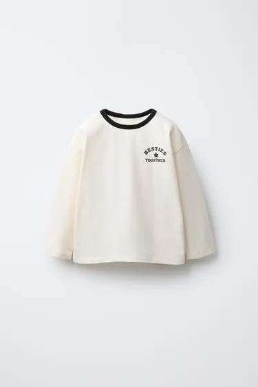 Лонгслив с блестящим принтом- Заказать в России