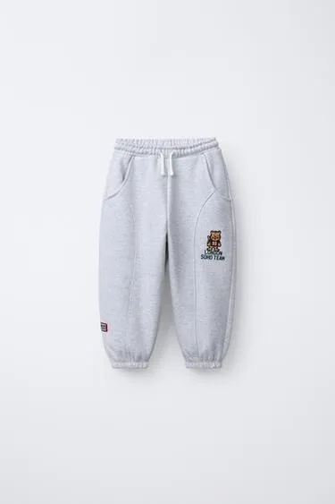 Брюки-джоггеры с вышивкой в виде животных- Заказать в России