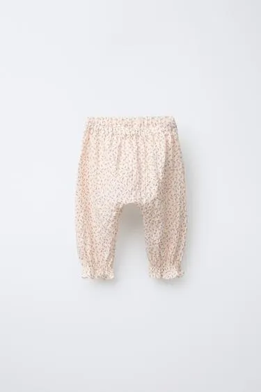 Брюки-джоггеры с цветочным рисунком- Заказать в России