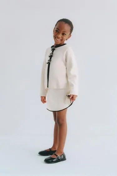 Трикотажная юбка с контрастными бантами- Заказать в России