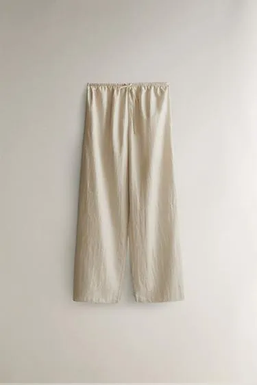 Брюки с атласным блеском