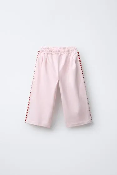 Брюки с защипами и сердечками- Заказать в России