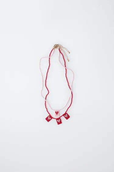 Набор из двух ожерелий с бусинами и сердечками