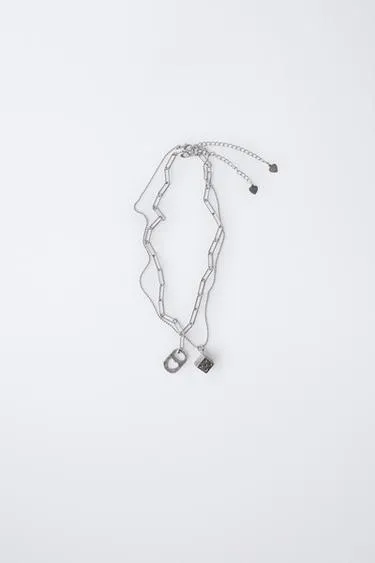 Набор из двух ожерелий с пластиной и кубиком