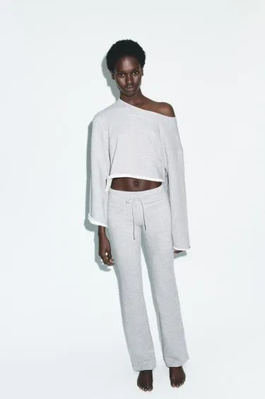 Расклешенные брюки с эффектом потертости- Заказать в России