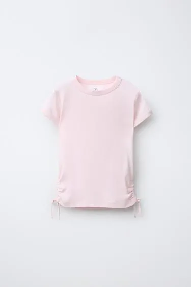 Футболка из модала с вырезами и бантами