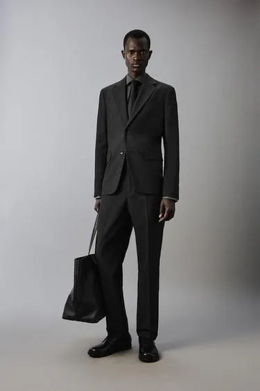 Костюмные брюки в клетку из рельефной ткани- Заказать в России