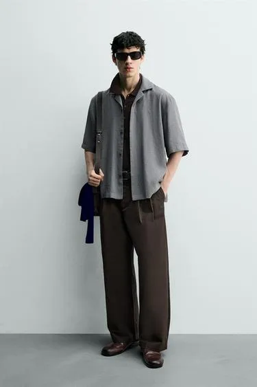 Рубашка в клетку с плавным фасоном