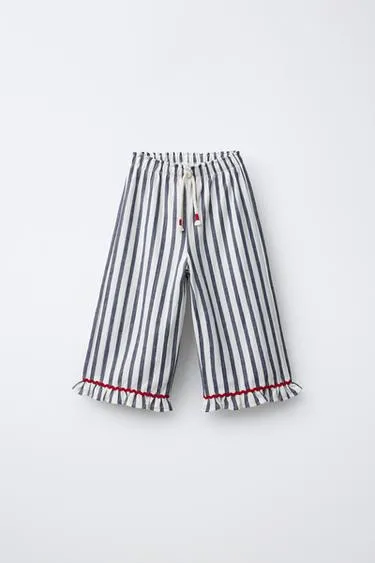 Брюки в полоску с воланами- Заказать в России