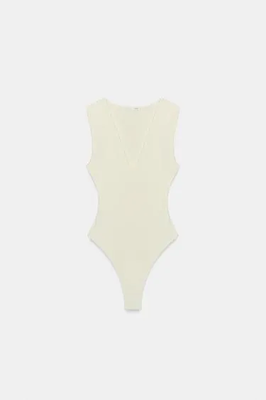 Облегающее боди с V-образным вырезом- Заказать в России