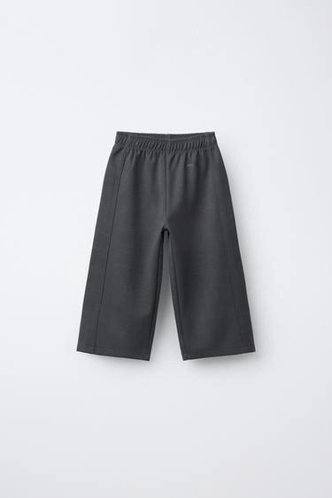 Wide-leg interlock trousers with raised slogan
