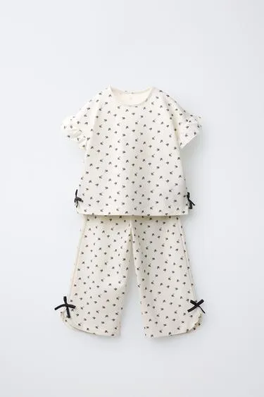 Комплект из футболки и брюк с цветочным принтом и бантами- Заказать в России