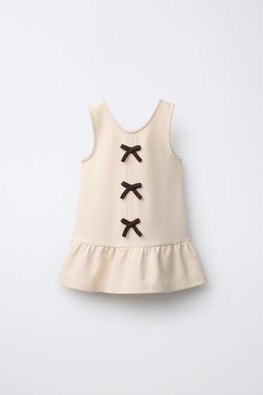 Трикотажное платье из плотного трикотажа с контрастными завязками- Заказать в России