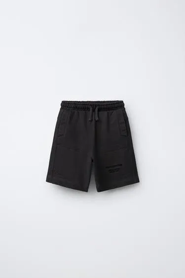 Шорты из мягкой ткани с вышитым текстом- Заказать в России