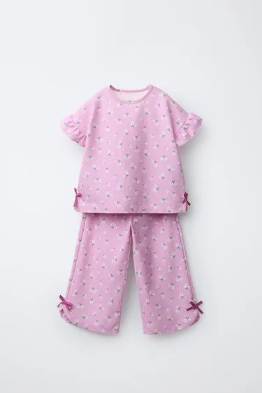 Комплект из футболки и брюк с цветочным принтом и бантами- Заказать в России