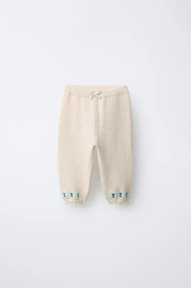 Брюки с вышитыми цветами и кружевом- Заказать в России