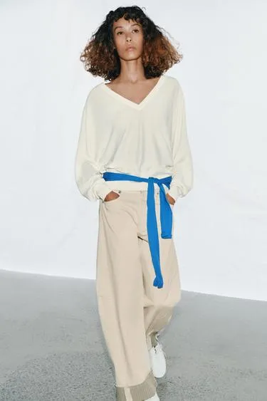 Вязаный джерси с V-образным вырезом- Заказать в России