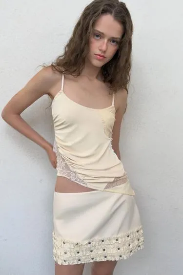 Мини-юбка с воланами и заклепками- Заказать в России