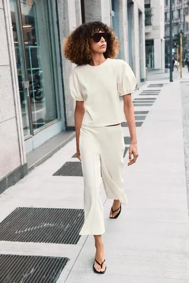 Топ с объемными рукавами- Заказать в России