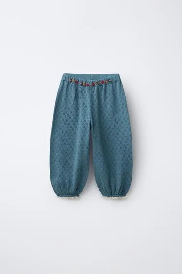 Трикотажные брюки с вышитыми цветами- Заказать в России