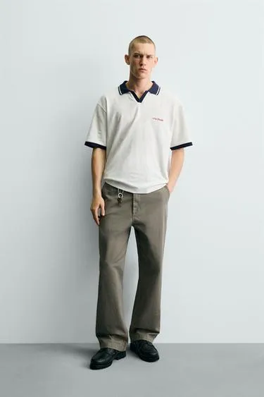 Вертикальное поло Jacquard с вышивкой