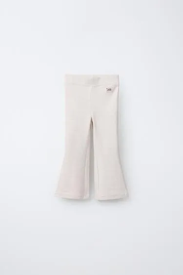 Легинсы клёш из интерлока с этикеткой- Заказать в России