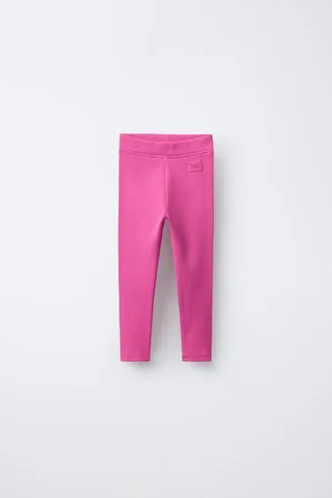 Леггинсы в рубчик с этикеткой