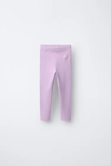 Леггинсы в рубчик с этикеткой