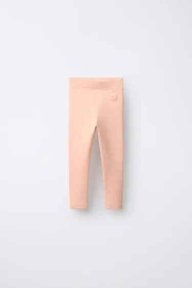 Леггинсы в рубчик с этикеткой