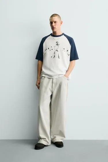 Трикотажная футболка колор-блок с принтом- Заказать в России