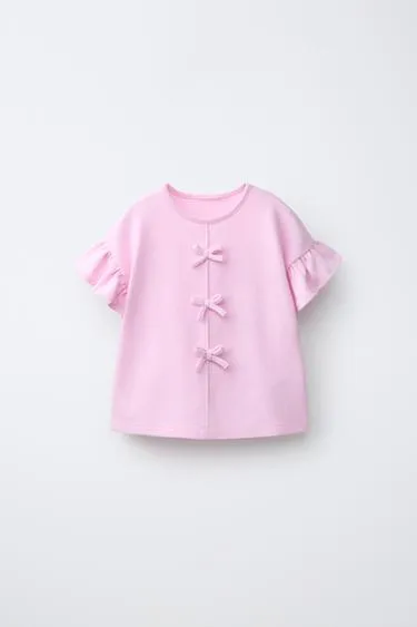 Футболка с бантами и воланами