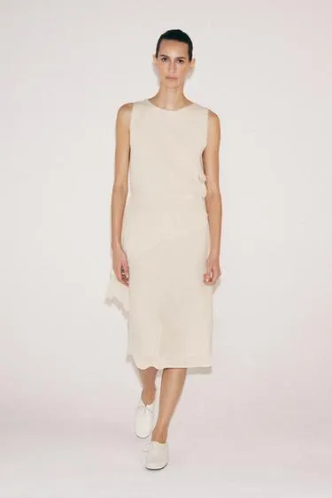 Топ асимметричного кроя с вырезами