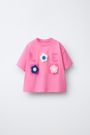 Футболка с вязаными цветами- Заказать в России