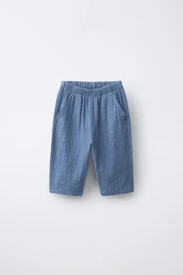 Брюки комбинированной текстуры- Заказать в России