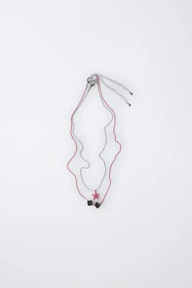 Набор из двух ожерелий с кубиками и звездами- Заказать в России