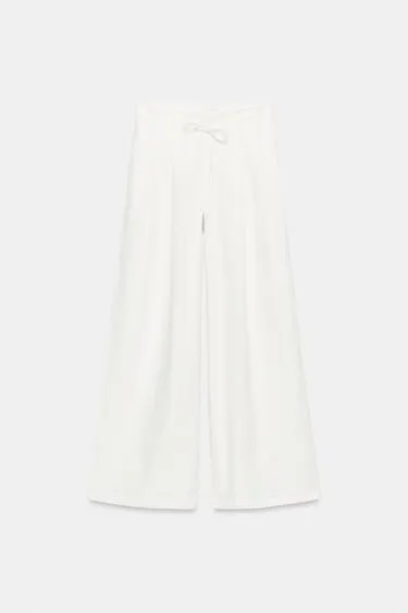 Широкие брюки с защипами