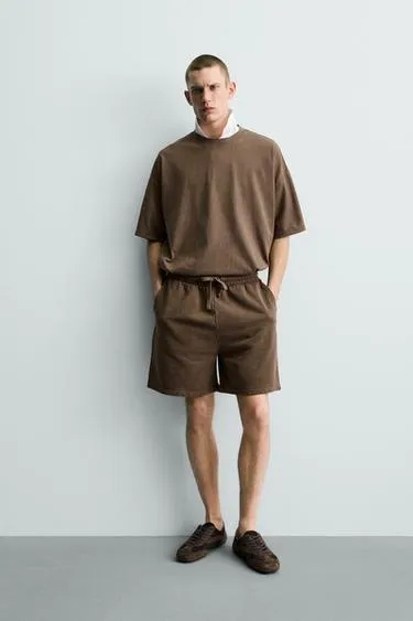 Шорты-джоггеры из ткани с эффектом потертости- Заказать в России