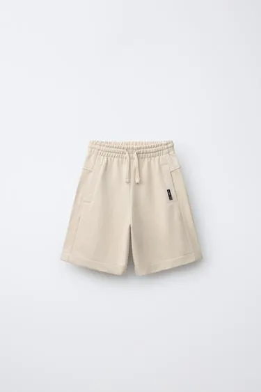 Шорты из мягкой ткани с этикеткой- Заказать в России