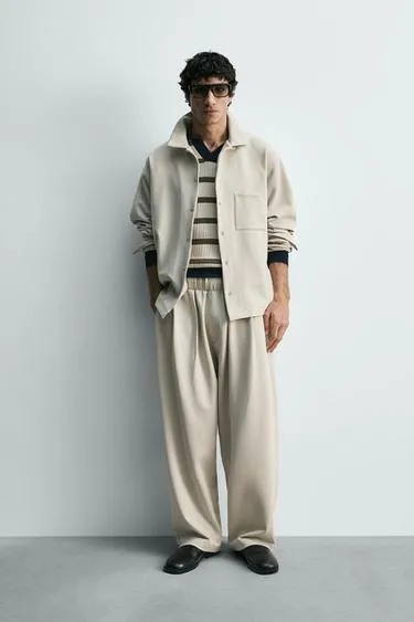 Брюки со складками из ткани интерлок- Заказать в России